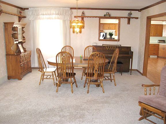 Formal dining room with newer carpet, plenty of space for large table!