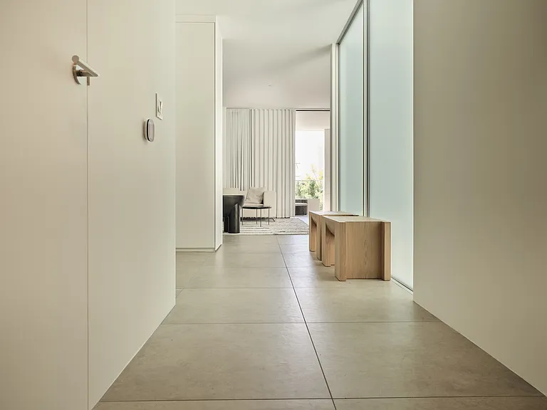 Sleek Modern Kitchen with Integrated Storage _ Featuring a bold marble island and floor-to-ceiling custom flush cabinetry, this kitchen is designed for both style and efficiency.