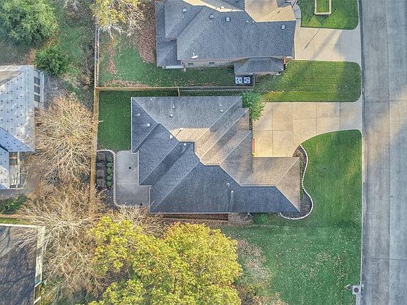 Attractive landscaping and a fenced back yard.