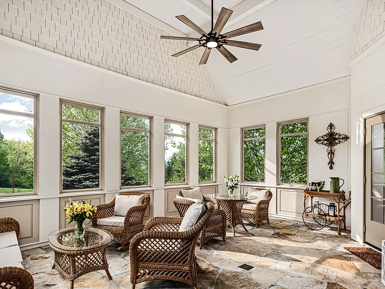 Inviting Three-Season Room Off Kitchen _ Screened Windows, Fireplace & Ample Seating