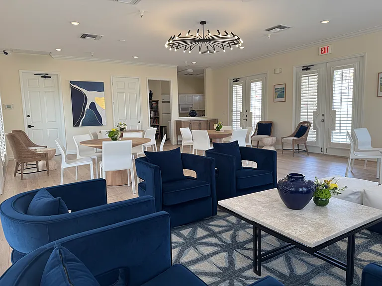 Clubhouse seating area, tables and kitchen