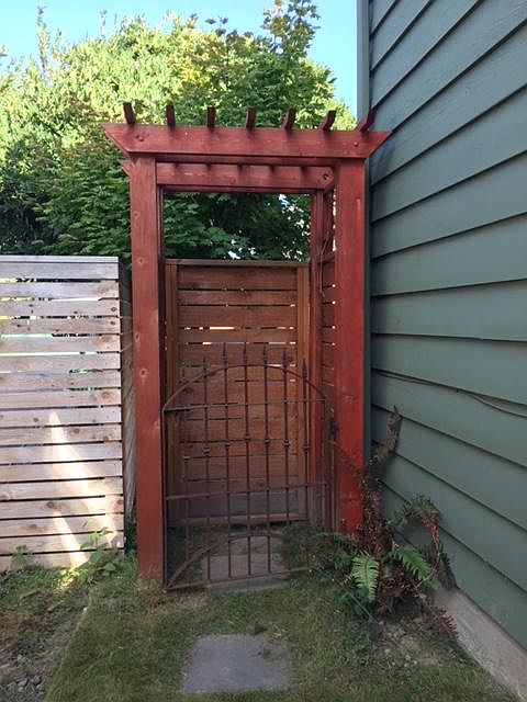 Entry gate off of sideyard to basement apartment.