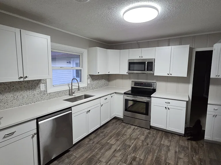 Kitchen with refrigerator