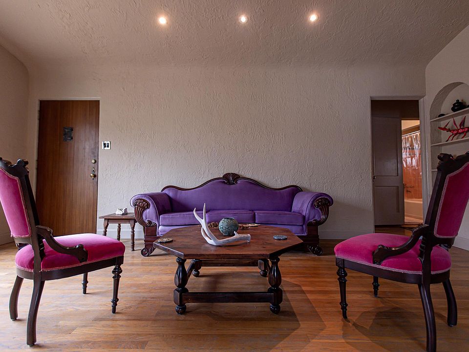 Watch the star light up every night on El Paso's Franklin Mountains from this purple suede couch.