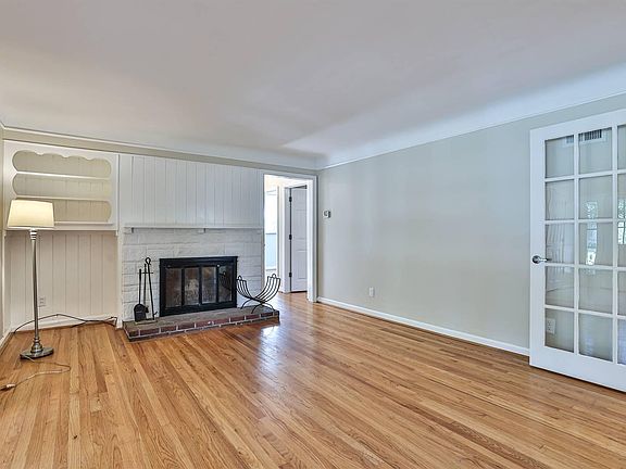 Living room with wood burning fireplace