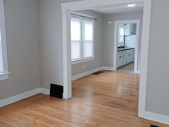 living room looking into dining room & kitchen