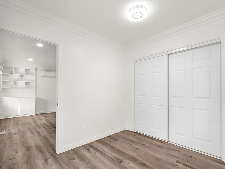 Second bedroom. Closet includes organization shelves.