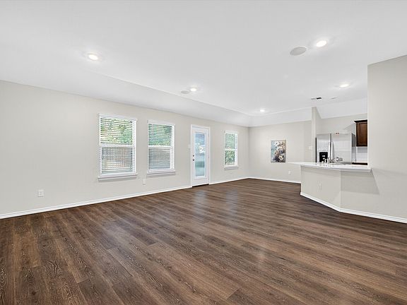 Open living to dining and kitchen