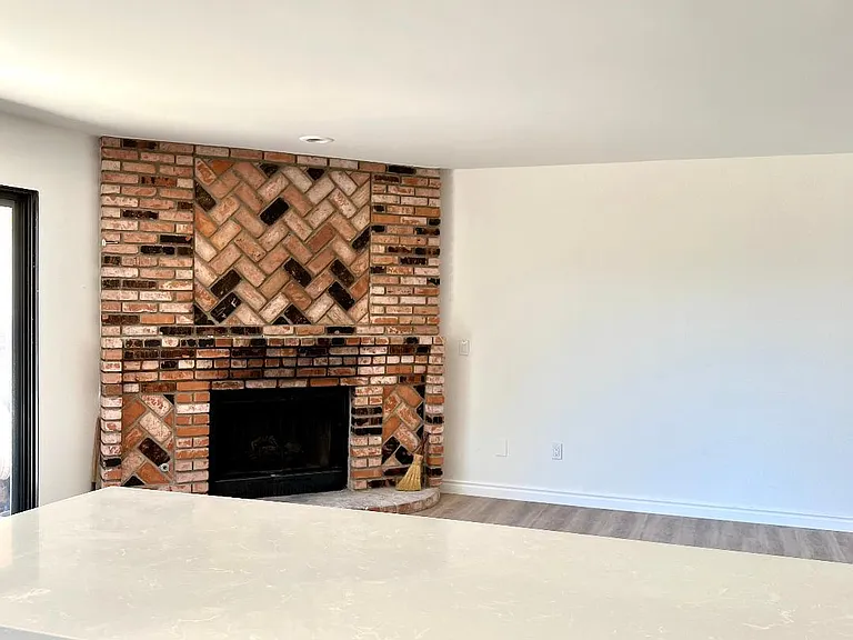 Breakfast bar area and Family room with fire place.