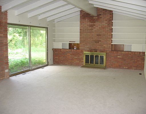 Living Room with Fireplace and Vaulted Ceiling