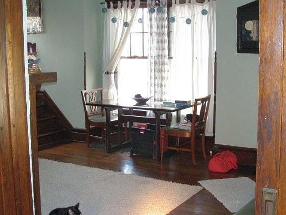 Living room with lots of light and original hardwood floors