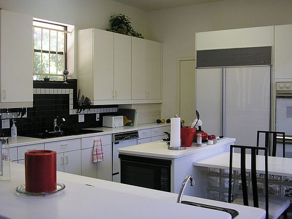 Gourmet kitchen features SubZero fride, wet bar and ice maker