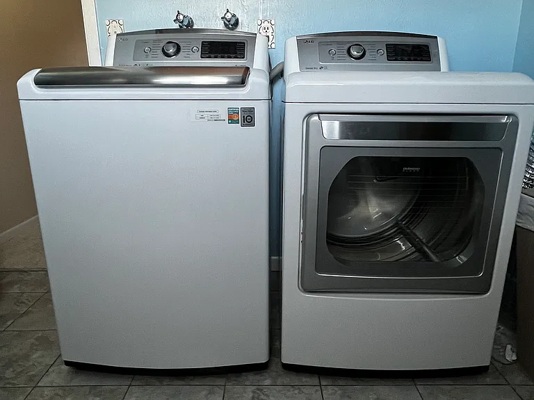 Full-size washer and dryer available in the shared lower-level laundry room.