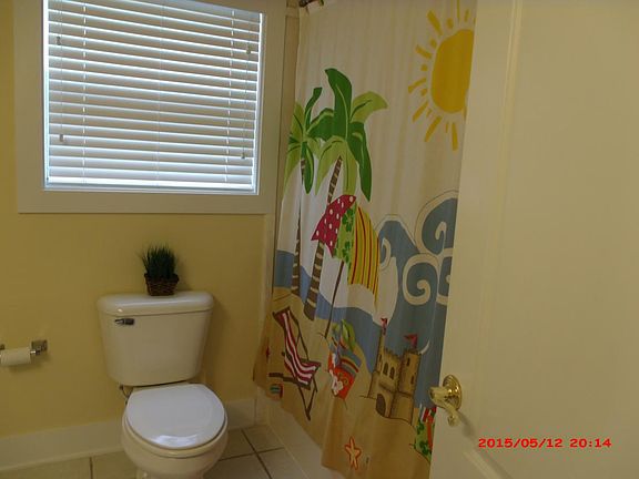 Bathroom entry from bedroom and living room