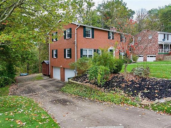 The classic two story home offers a two car garage and a large shed for additional storage.