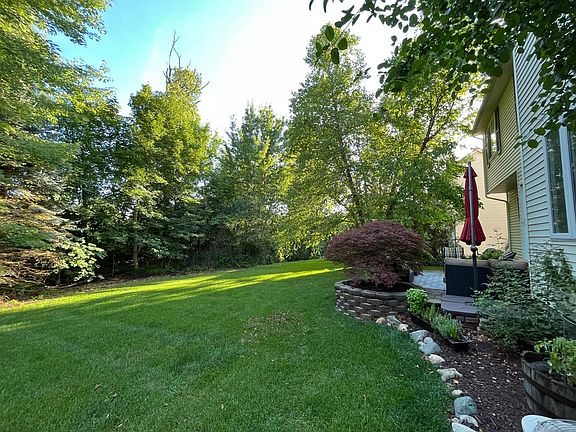 Private wooded South facing backyard