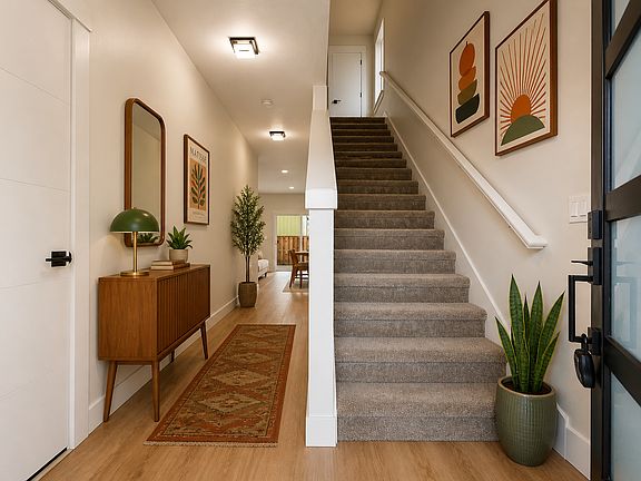 Extra wide entry hallway. 

Photos may include AI-generated virtual staging to help visualize the home's potential. Finishes and layout remain unchanged.