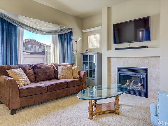 Living room provides abundance of natural light.