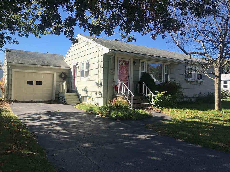 Ranch style with attached garage and motorized garage door.