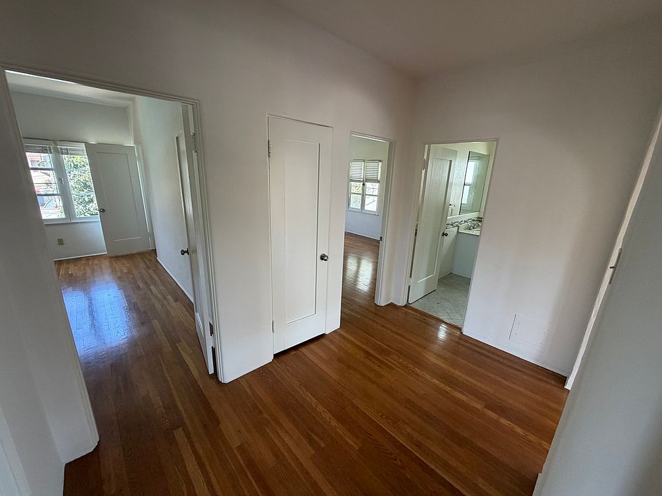 Central corridor connecting to the two bedrooms, bathroom, kitchen, living room and dining room