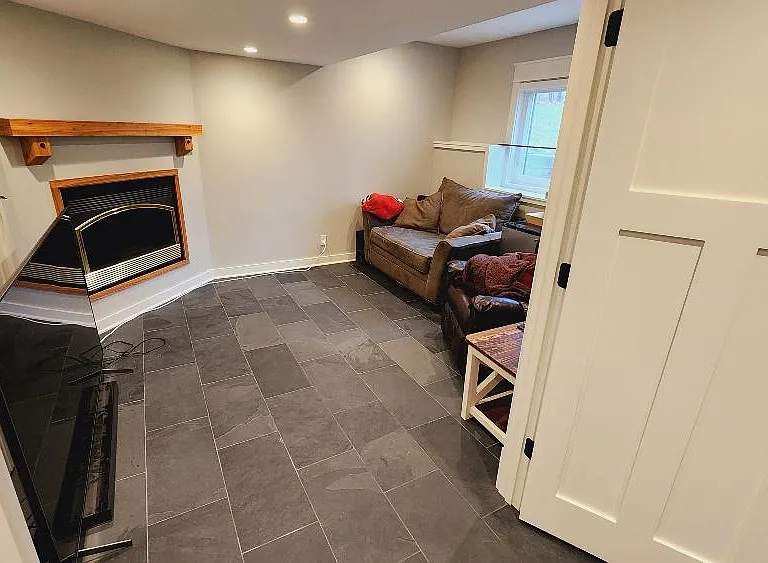 Basement private office with fire place.