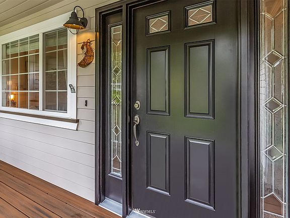 Beautiful front entry door with sidelights.