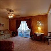 Spacious family room and notice the view of the sun-room in the back.
