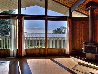 inside looking out at snowcapped Mauna Kea view