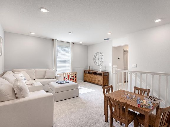 A flex-use loft is located at the upstairs landing - Photos showcase a model home with similar finis