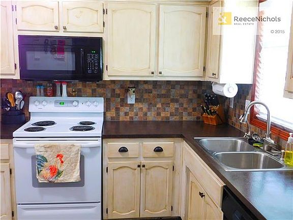 Beautiful kitchen with updated cabinets and tile backspash