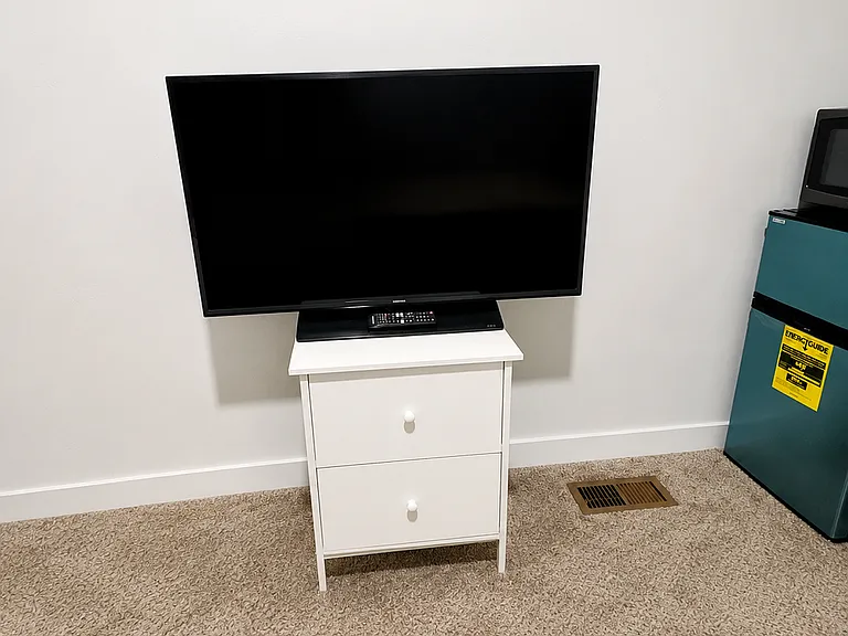 TV and Stand fully available for use.