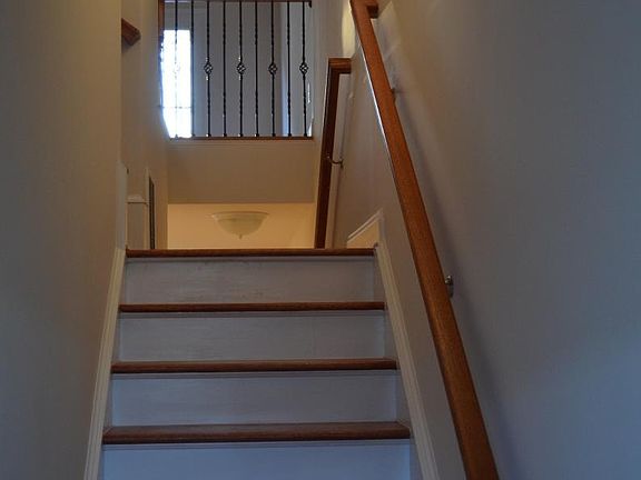 Stairs to the second floor and the big room behind the garag