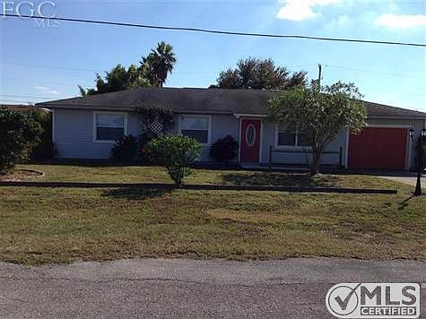 Flowering trees and bushes adorn this property. Hibiscus, J