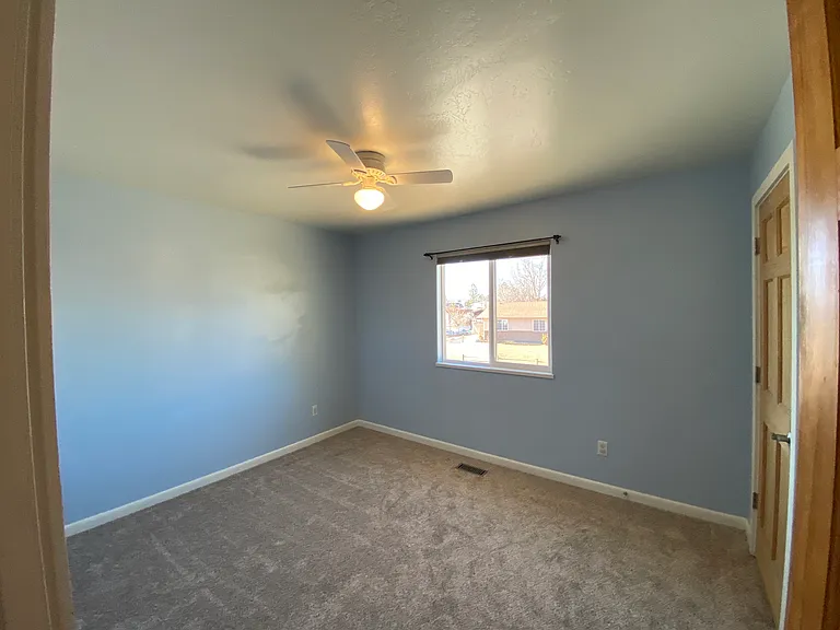 Comfortable bedroom with natural light and closet space.