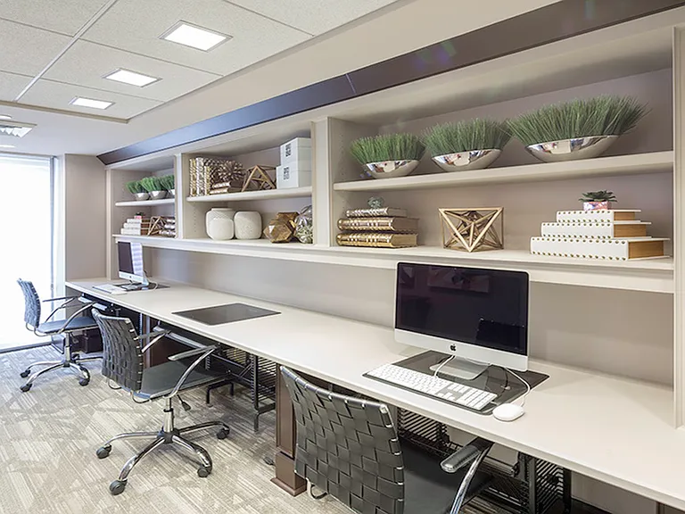 Brightly lit business centers with Mac computers