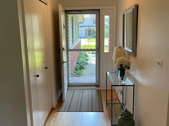 Sunlight filled entryway w/large coat closet.