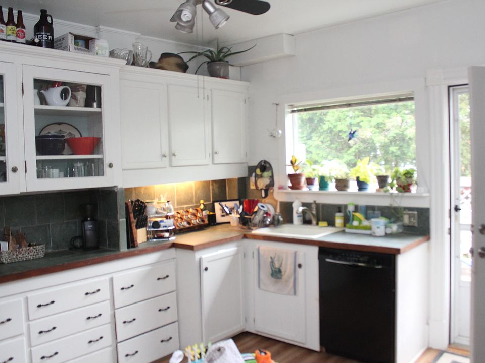 Kitchen with dishwasher and deck
