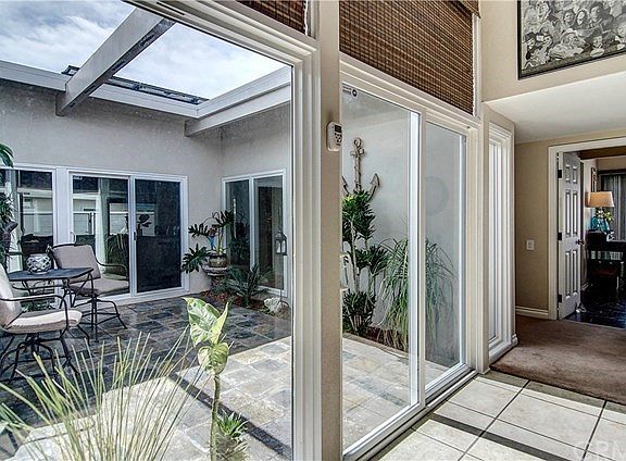 This enclosed outdoor atrium can be accessed through 3 different rooms in the house.