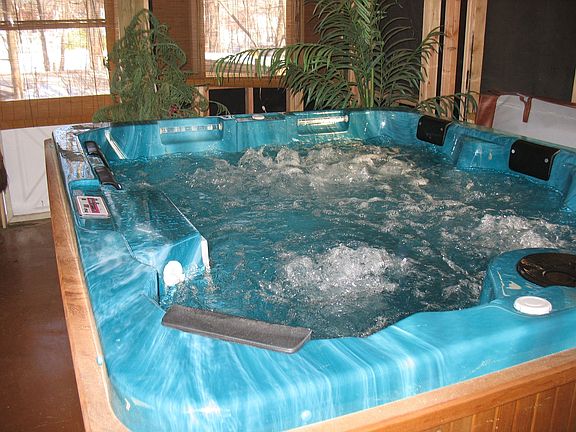 Relieve the stress of your day in 5-person hot tub!
