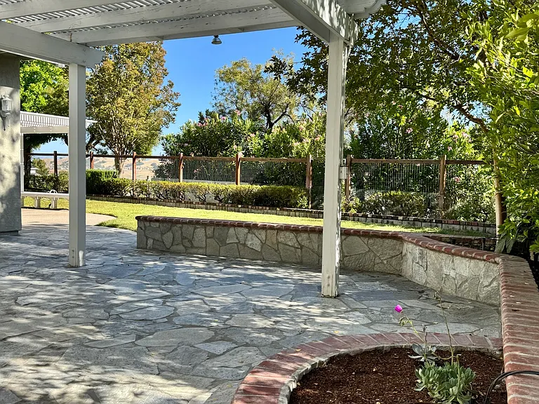 Large backyard with pergolas, green, no back neighbors and stunning views of the valley.