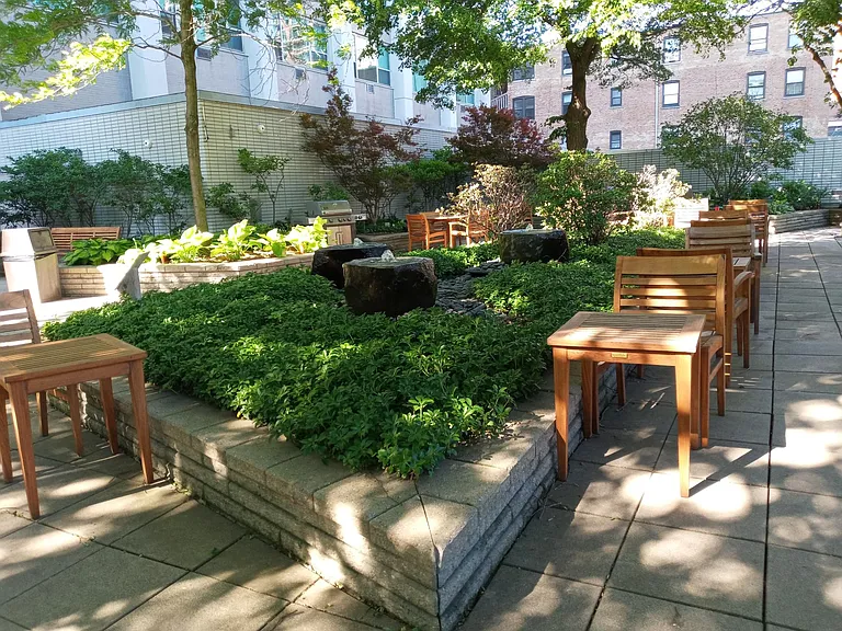 Award winning shaded patio with BBQ grilles and zen-like fountains