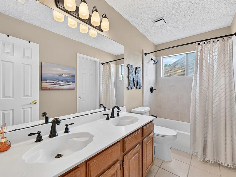 Upstairs full bath connects to middle bedroom making it ideal for a guest room