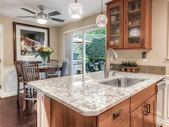 Sliding glass door slips you out to your private backyard for BBQs and hot tubbing! 
