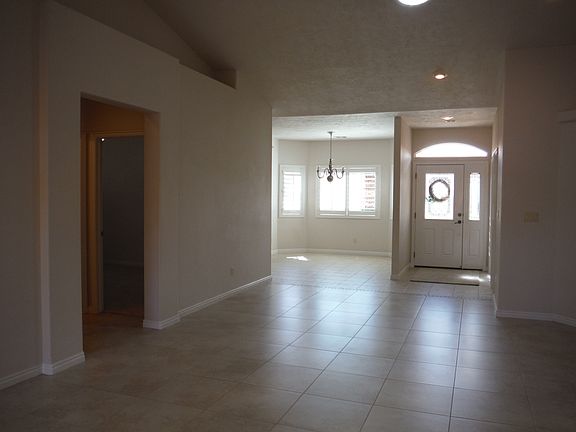 Living room looking toward entry door and dining area