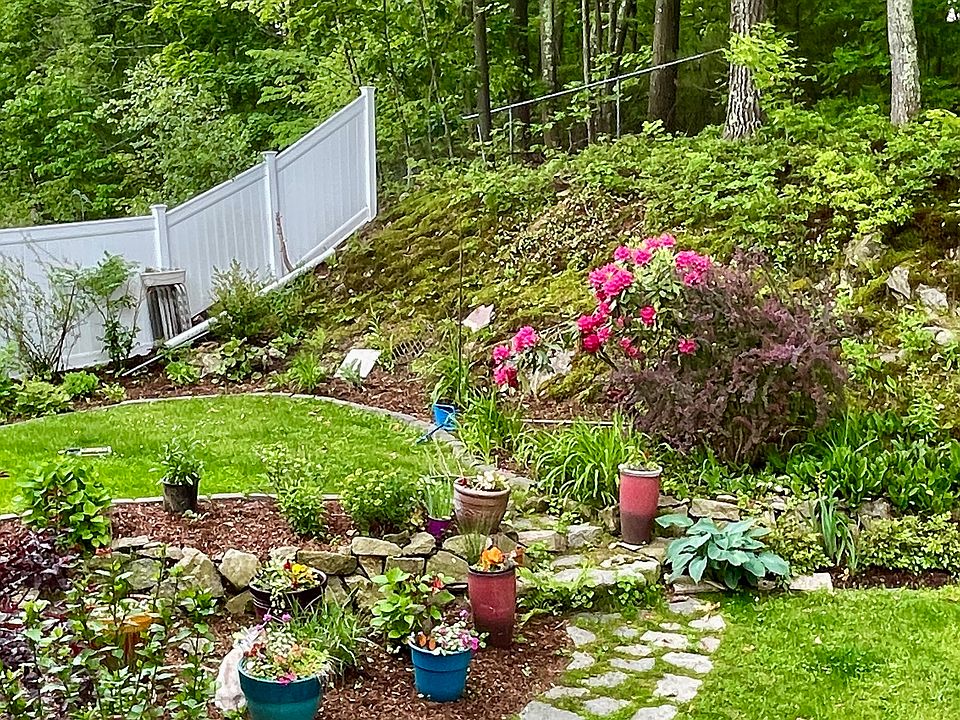 The owner who lives in the basement apartment takes pride and caring for the yard and the gardens.
