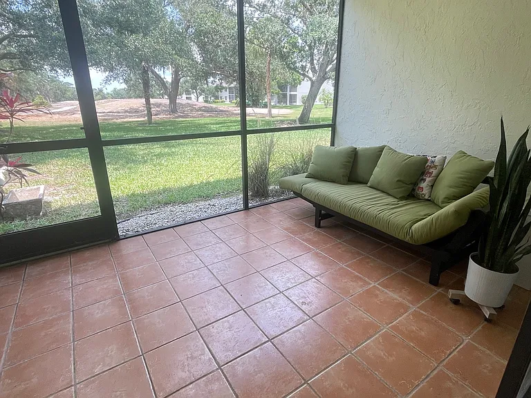 screened lanai with view of golf course