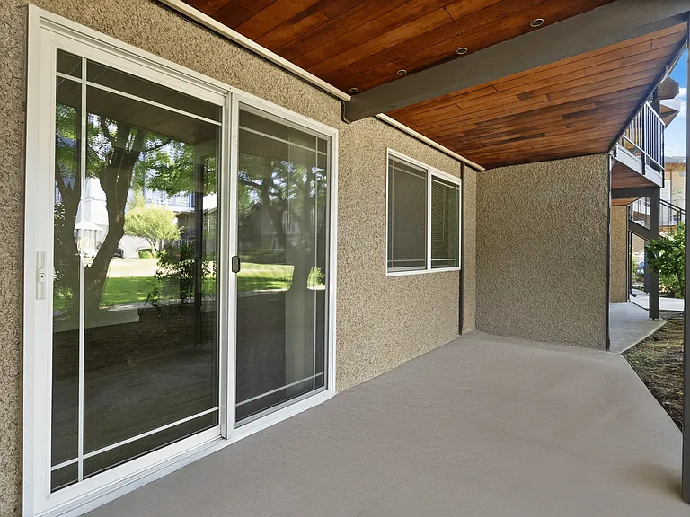 Private covered patio with easy outdoor access. Private covered patio with easy outdoor access.