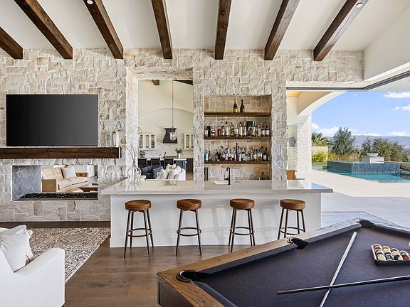 Practice your mixology skills from the bar area or spark competition from the pool table.