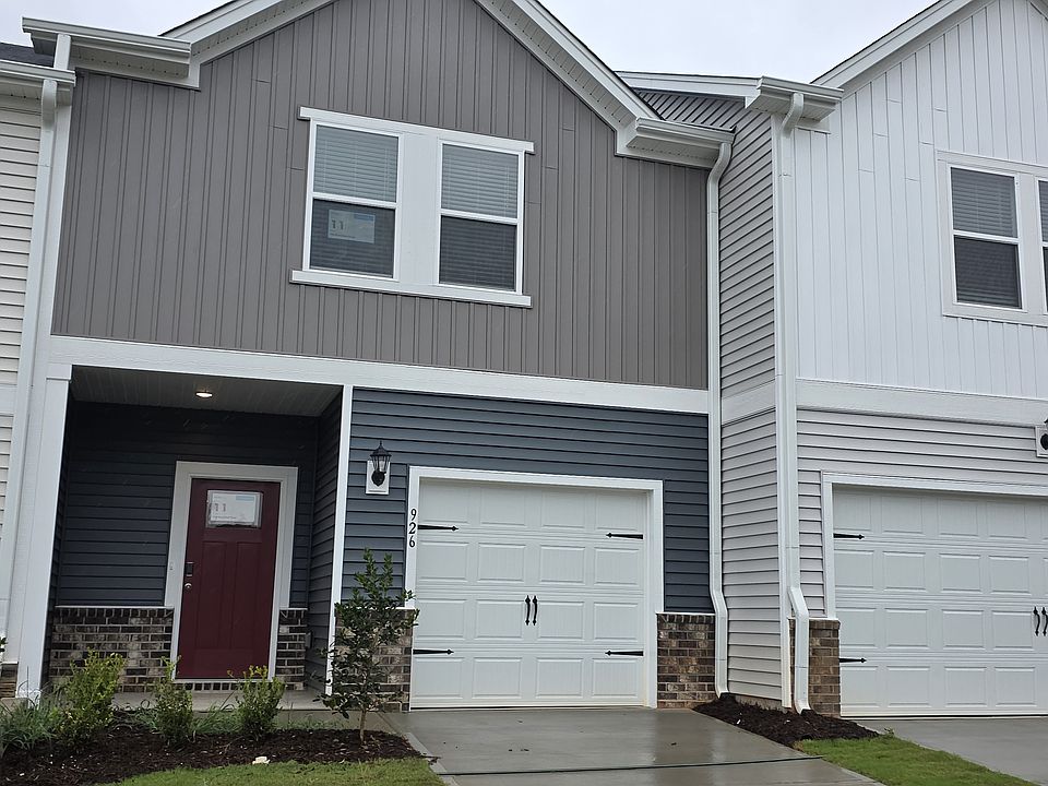 Front entrance on Broadleaf Trace with windows from the two front bedrooms.