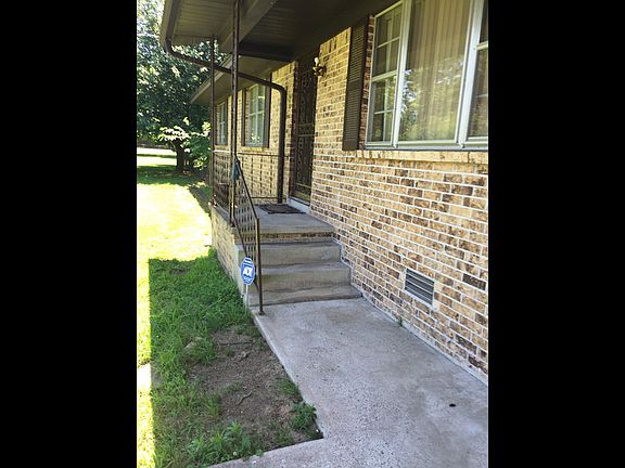 Front View ,two car garage ,concrete walking path